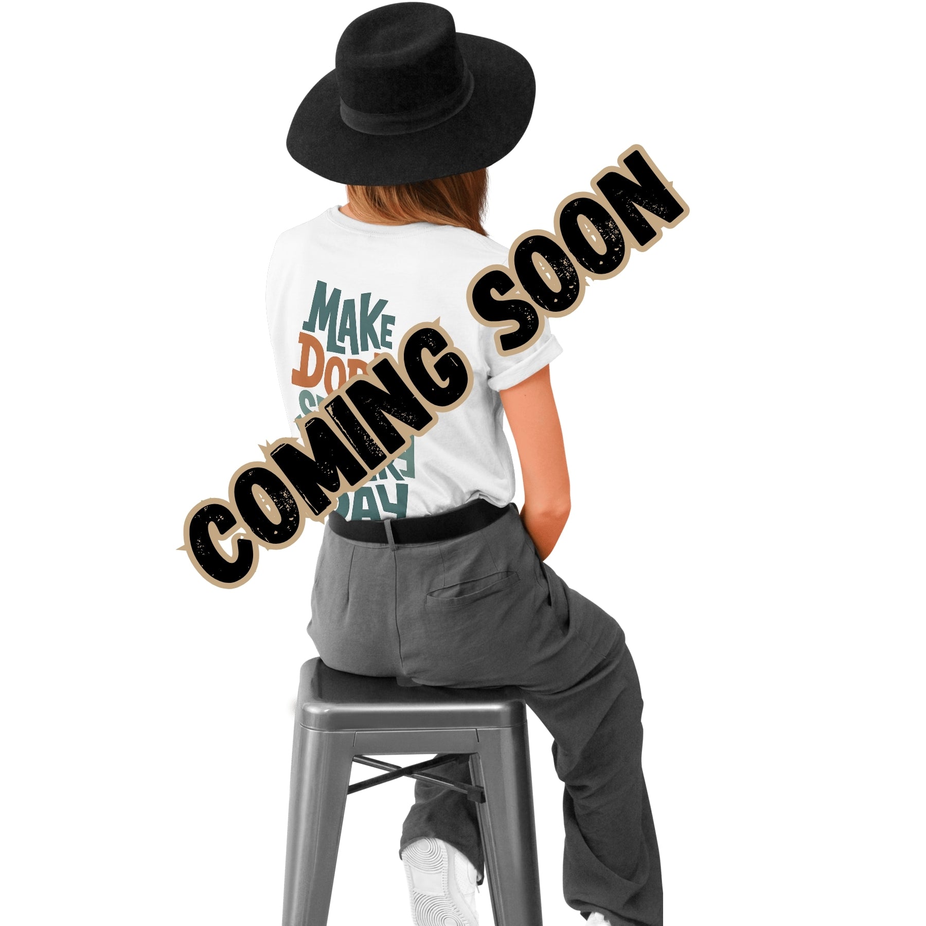 Person sitting on a stool wearing a white t-shirt with text and a black hat, with 'COMING SOON' text overlay.